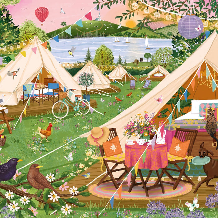Tents on green grass by the sea - a very cozy scene of glamping